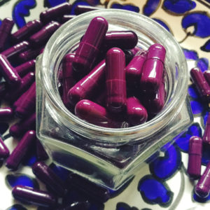 Purple Placenta Pills in a small jar